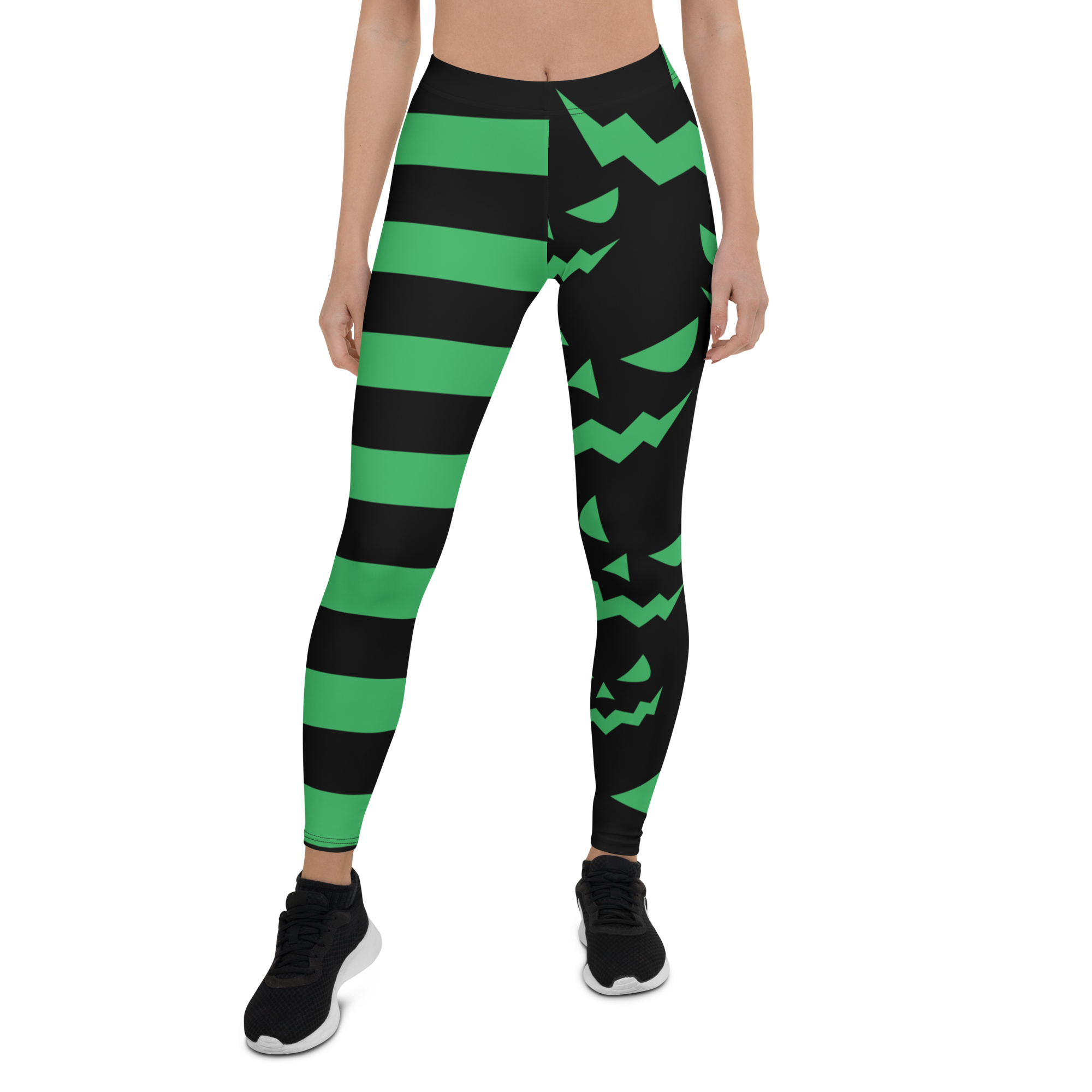 Green and black striped leggings with jack-o'-lantern face design – Halloween pumpkin leggings by Haunt Shirts