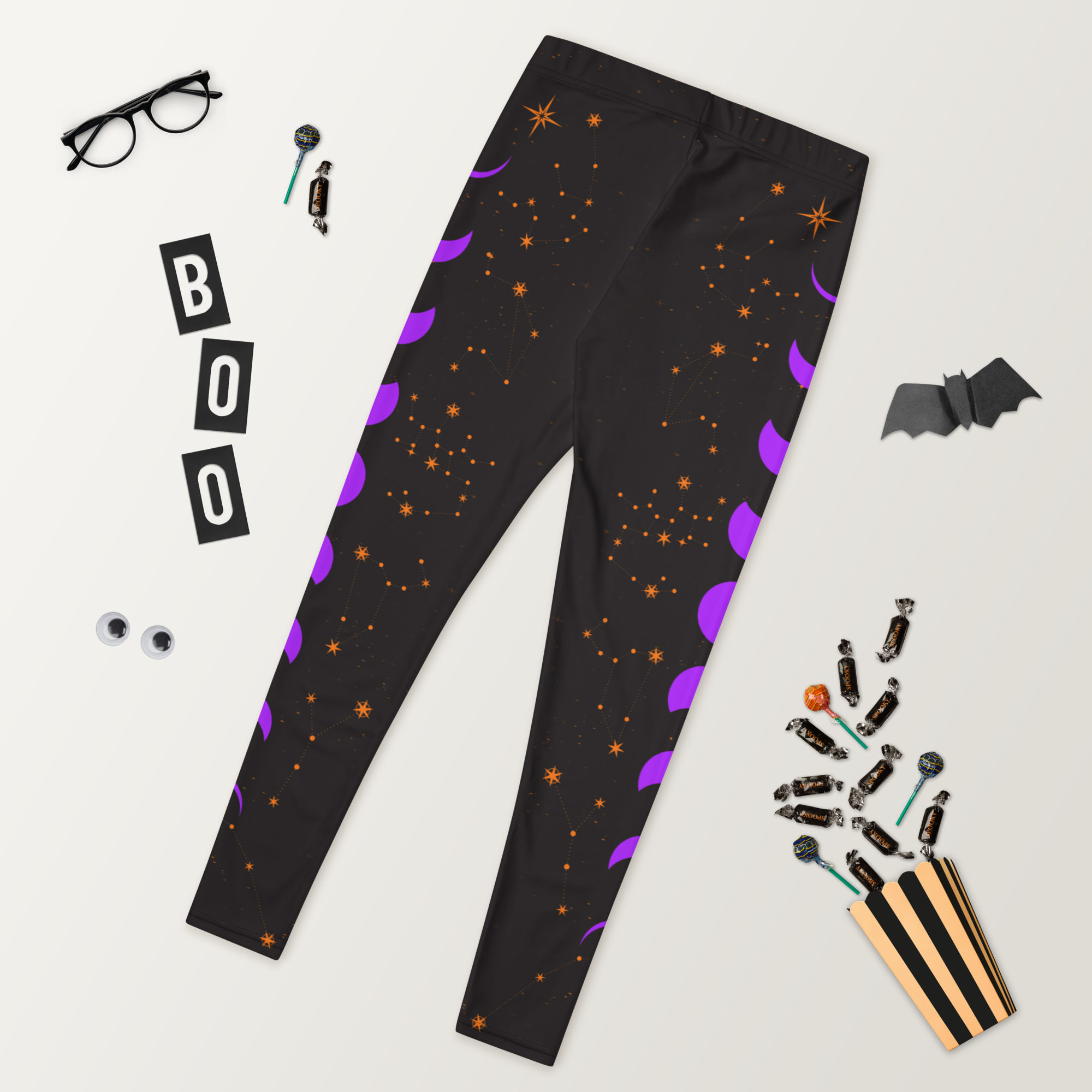 Ladies celestial leggings with orange stars and purple moon phases – cosmic design by Haunt Shirts